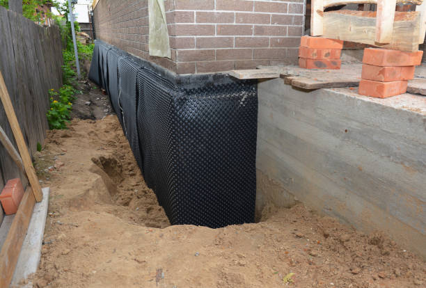 Happy homeowners after waterproofing job in Pennsauken